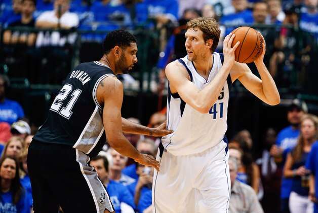 Apr 26, 2014; Dallas, TX, USA; Dallas Mavericks forward Dirk Nowitzki (41) looks to shoot as San Antonio Spurs forward Tim Duncan (21) defends during the game in game three of the first round of the 2014 NBA Playoffs at American Airlines Center. Dallas won 109-108. Mandatory Credit: Kevin Jairaj-USA TODAY Sports