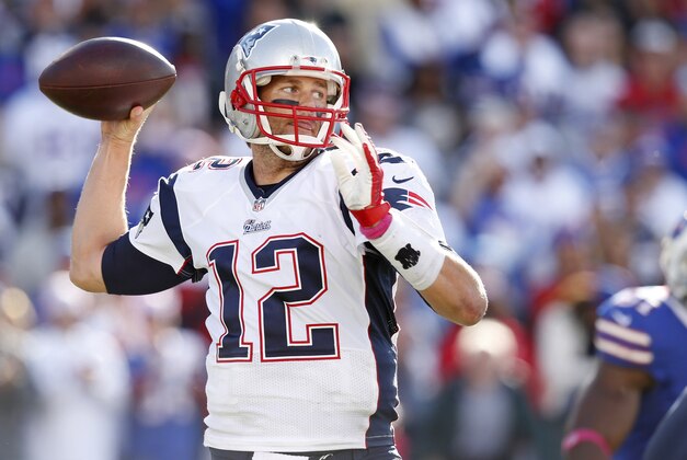 Oct 12, 2014; Orchard Park, NY, USA; New England Patriots quarterback Tom Brady (12) drops to pass during the 2nd half against the Buffalo Bills at Ralph Wilson Stadium. Patriots beat the Bills 37-22. Mandatory Credit: Kevin Hoffman-USA TODAY Sports