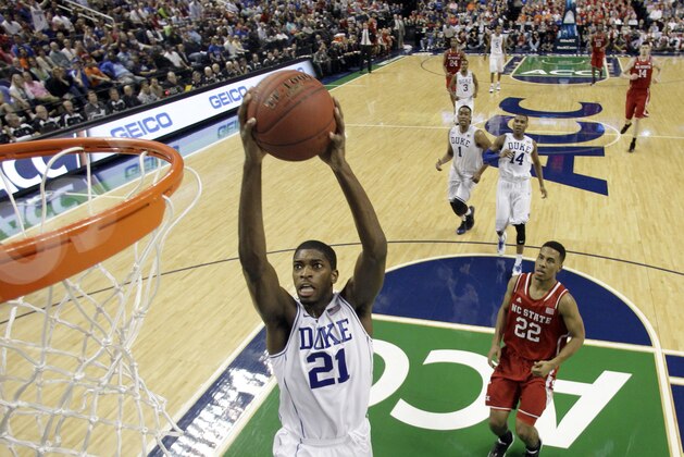 Duke's Amile Jefferson (21) dunks against North Carolina State during the second half of an NCAA college basketball game in the semifinals of the Atlantic Coast Conference tournament in Greensboro, N.C., Saturday, March 15, 2014.  Duke won 75-67.(AP Photo/Bob Leverone)