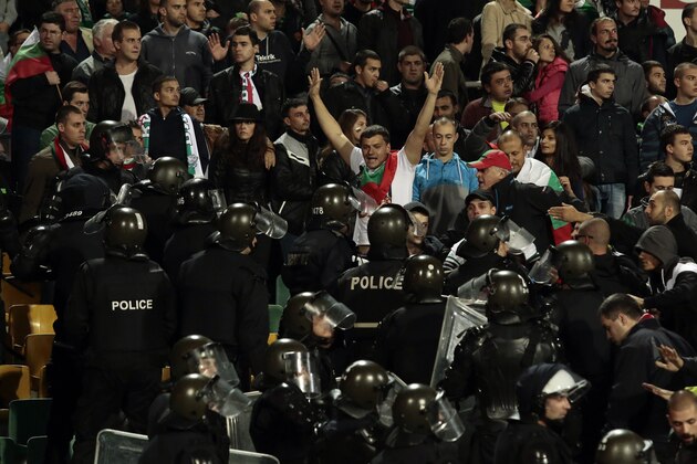 Bulgarian police clash with supporters of Bulgarian soccer team during their Euro 2016 group H qualifying soccer match against Croatia at Vassil Levski stadium in Sofia, Friday, Oct. 10, 2014. (AP Photo/Valentina Petrova)