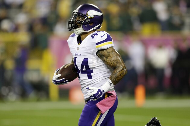 Minnesota Vikings quarterback Matt Asiata warms up before an NFL football game against the Green Bay Packers Thursday, Oct. 2, 2014, in Green Bay, Wis. (AP Photo/Tom Lynn)