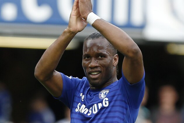 Chelsea's Didier Drogba applauds the fans at the end of their English Premier League soccer match against Leicester City at Stamford Bridge, London, Saturday, Aug. 23, 2014. (AP Photo/Sang Tan)