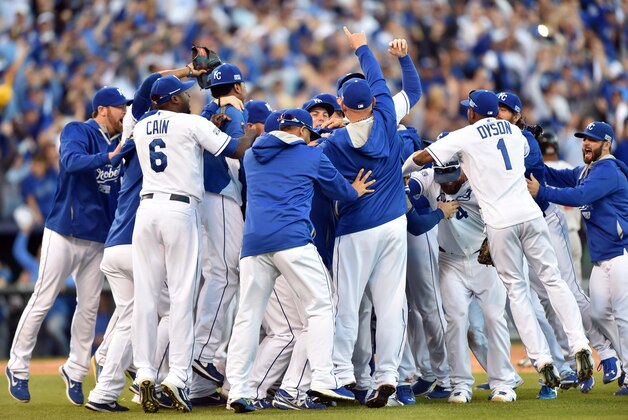 Oct 15, 2014; Kansas City, MO, USA; Kansas City Royals players celebrate on the field after defeating the Baltimore Orioles in game four of the 2014 ALCS playoff baseball game at Kauffman Stadium. The Royals swept the Orioles to advance to the World Series. Mandatory Credit: Peter G. Aiken-USA TODAY Sports Oct 15, 2014; Kansas City, MO, USA; Kansas City Royals players celebrate on the field after defeating the Baltimore Orioles in game four of the 2014 ALCS playoff baseball game at Kauffman Stadium. The Royals swept the Orioles to advance to the World Series. Mandatory Credit: Peter G. Aiken-USA TODAY Sports