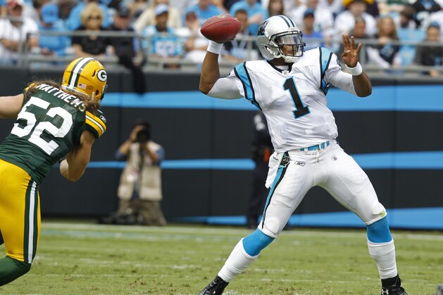 Carolina Panthers' Cam Newton (1) throws a pass under pressure from Green Bay Packers' Clay Matthews (52) during the first quarter of an NFL football game in Charlotte, N.C., Sunday, Sept. 18, 2011. (AP Photo/Chuck Burton)