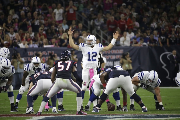 Indianapolis Colts quarterback Andrew Luck (12) calls a play during the first quarter of an NFL football game, Thursday, Oct. 9, 2014, in Houston. (AP Photo/David J. Phillip)