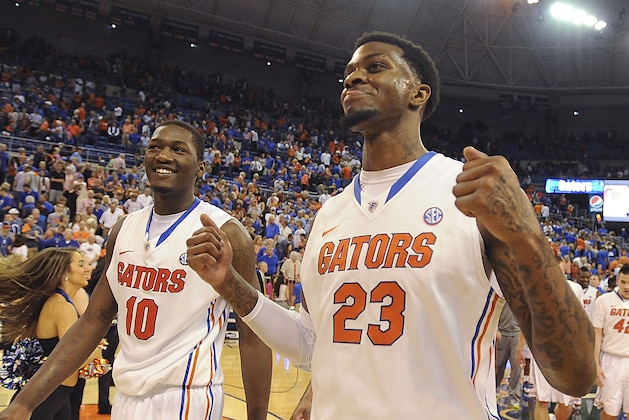 Florida's Chris Walker (23) and Dorian Finney-Smith (10) come off the court with smiles after Florida defeated LSU 79-61 in an NCAA college basketball game Saturday, March 1, 2014, in Gainesville, Fla.  (AP Photo/Phil Sandlin)