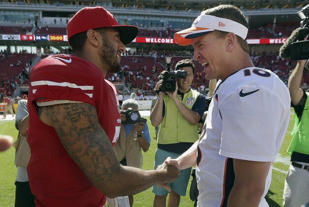 San Francisco 49ers quarterback Colin Kaepernick, left, shakes hands with Denver Broncos quarterback Peyton Manning after an NFL preseason football game in Santa Clara, Calif., Sunday, Aug. 17, 2014. The Broncos won 34-0. (AP Photo/Marcio Jose Sanchez)