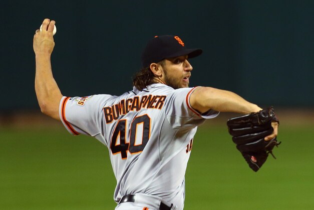 San Francisco Giants starting pitcher Madison Bumgarner throws during the first inning of Game 1 of the National League baseball championship series against the St. Louis Cardinals Saturday, Oct. 11, 2014, in St. Louis. (AP Photo/Dilip Vishwanat, Pool)