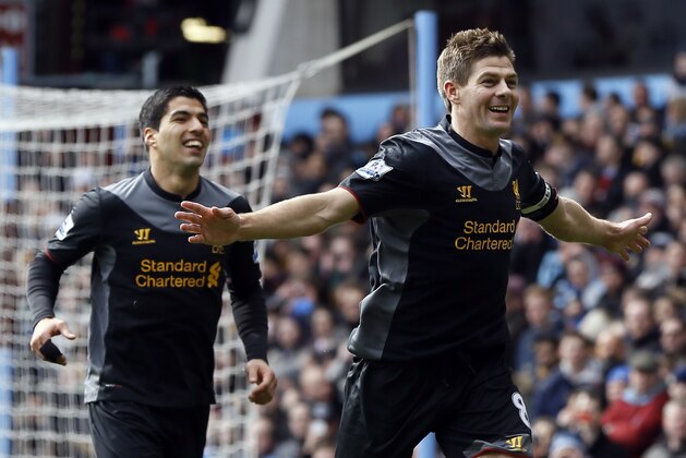 Liverpool's  Steven Gerrard, right, celebrates scoring a goal with Luis Suarez, during the English Premier League soccer match between Aston Villa and Liverpool at Villa Park Stadium in Birmingham, England, Sunday, March 31, 2013. (AP Photo/Kirsty Wigglesworth)