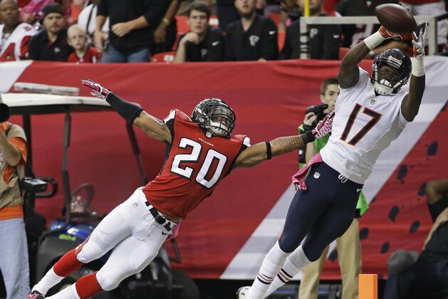 Chicago Bears wide receiver Alshon Jeffery (17) makes the catch but out of bounds against Atlanta Falcons free safety Dwight Lowery (20) during the first half of an NFL football game, Sunday, Oct. 12, 2014, in Atlanta.  (AP Photo/David Goldman)