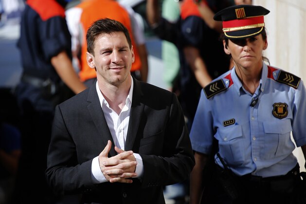 FILE - In this Sept. 27, 2013 file photo, FC Barcelona star Lionel Messi, left, arrives at a court to answer questions in a tax fraud case in Gava, near Barcelona, Spain. A Spanish judge on Monday July 28, 2014 has rejected a prosecutor's request to drop charges of tax fraud against Messi and ordered the investigation into three cases of suspected unpaid taxes to proceed. A court statement says there is