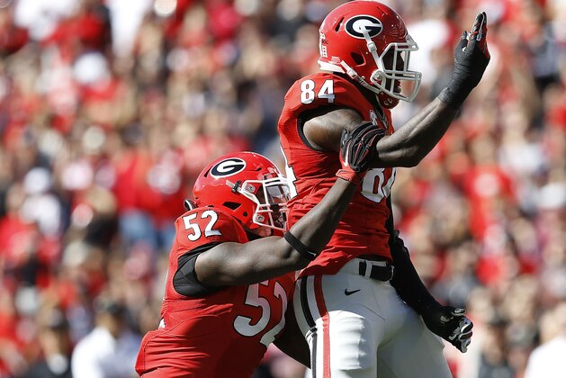 ATHENS, GA - OCTOBER 04:  Linebackers Amarlo Herrera #52 and Leonard Floyd of the Georgia Bulldogs celebrate after a sack during the game against the Vanderbilt Commodores at Sanford Stadium on October 4, 2014 in Athens, Georgia.  (Photo by Mike Zarrilli/Getty Images)