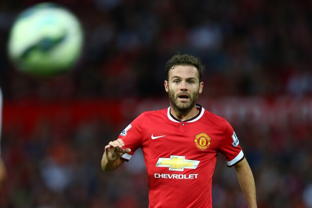 MANCHESTER, ENGLAND - AUGUST 12:  Juan Mata of Manchester United in action during the Pre Season Friendly match between Manchester United and Valencia at Old Trafford on August 12, 2014 in Manchester, England.  (Photo by Clive Brunskill/Getty Images)