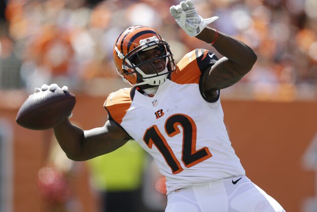Cincinnati Bengals wide receiver Mohamed Sanu throws a 50-yard pass in the first half of an NFL football game against the Atlanta Falcons, Sunday, Sept. 14, 2014, in Cincinnati. (AP Photo/Michael Conroy)