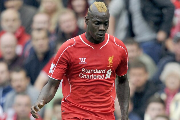 Liverpool's Mario Balotelli in action during their English Premier League soccer match against Everton at Anfield in Liverpool, England, Saturday Sept. 27, 2014. (AP Photo/Clint Hughes)