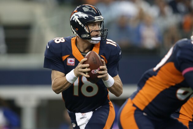 Denver Broncos quarterback Peyton Manning (18) drops back to pass against the Dallas Cowboys during the first quarter of an NFL football game, Sunday, Oct. 6, 2013, in Arlington, Texas. The Broncos won 51-48. (AP Photo/Tony Gutierrez)