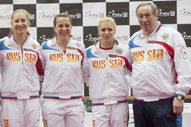 Russia's national tennis team, from left, Elena Vesnina, Ekaterina Makarova, Anastasia Pavlyuchenkova, Maria Kirilenko, and team captain Shamil Tarpischev pose after a draw ceremony prior the Fed Cup match between Russia and Slovakia in Moscow, Russia, Friday, April 19, 2013. (AP Photo/Misha Japaridze)