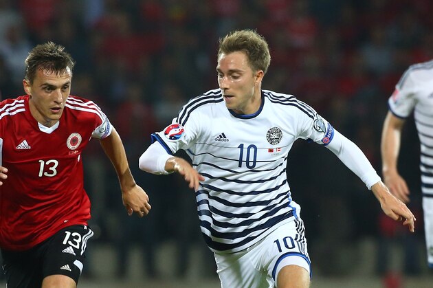 Albania's Burim Kukeli, left, vies for the ball with Denmark's Christian Eriksen during their Euro 2016 qualifying soccer match at the Elbasan Arena stadium in Elbasan, Albania, Saturday, Oct. 11, 2014. (AP Photo/Hektor Pustina)