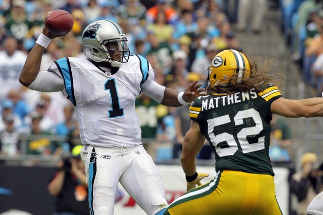 Green Bay Packers' Clay Matthews (52) rushes Carolina Panthers quarterback  Cam Newton (1) during the first half of an NFL football game in Charlotte, N.C., Sunday, Sept. 18, 2011. (AP Photo/Gerry Broome)