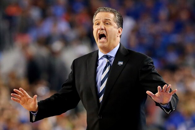 ARLINGTON, TX - APRIL 07:  Head coach John Calipari of the Kentucky Wildcats motions to his players during the NCAA Men's Final Four Championship against the Connecticut Huskies at AT&T Stadium on April 7, 2014 in Arlington, Texas.  (Photo by Ronald Martinez/Getty Images)