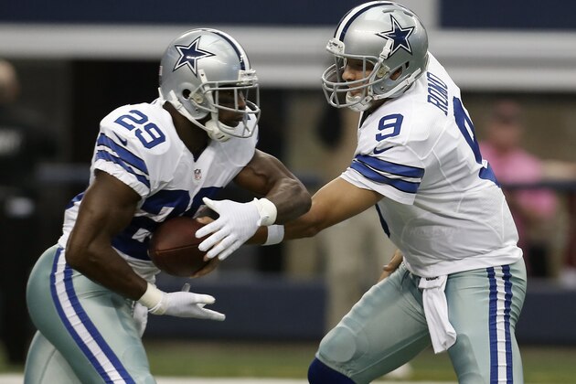 Dallas Cowboys running back DeMarco Murray (29) takes the hand off from quarterback Tony Romo (9) during the first half of an NFL football game against the Houston Texans, Sunday, Oct. 5, 2014, in Arlington, Texas. (AP Photo/Brandon Wade)
