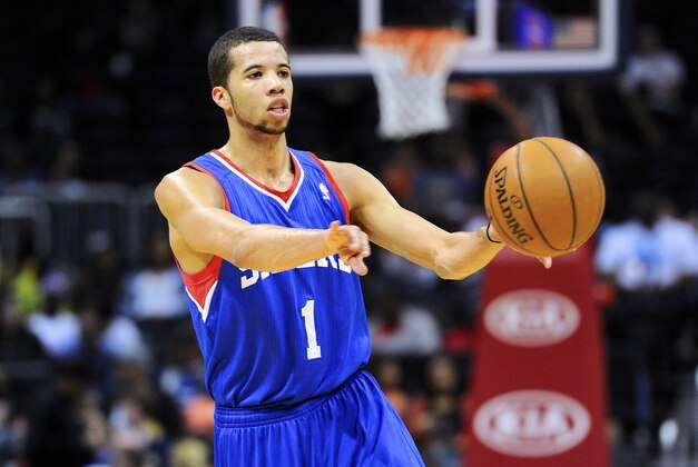 Mar 31, 2014; Atlanta, GA, USA; Philadelphia 76ers guard Michael Carter-Williams (1) passes the ball against the Atlanta Hawks  during the first half at Philips Arena. Mandatory Credit: Dale Zanine-USA TODAY Sports