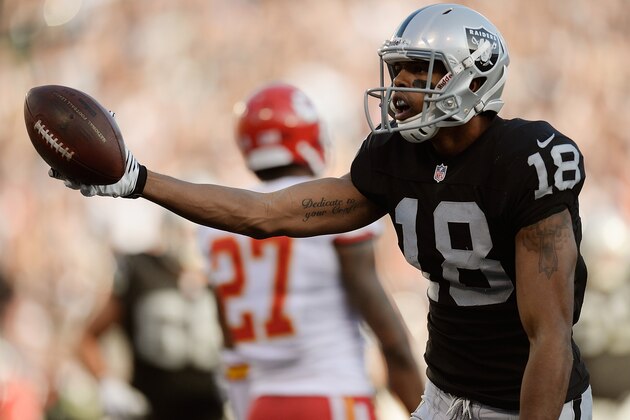 OAKLAND, CA - DECEMBER 15:  Andre Holmes #18 of the Oakland Raiders celebrates after catching a six yard touchdown pass against the Kansas City Cheifs during the third quarter at O.co Coliseum on December 15, 2013 in Oakland, California. The Cheifs won the game 56-31.  (Photo by Thearon W. Henderson/Getty Images)