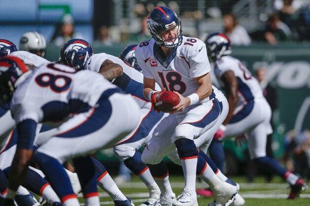 Denver Broncos quarterback Peyton Manning (18) takes the snap against the New York Jets in the second quarter of an NFL football game, Sunday, Oct. 12, 2014, in East Rutherford, N.J. (AP Photo/Kathy Willens)