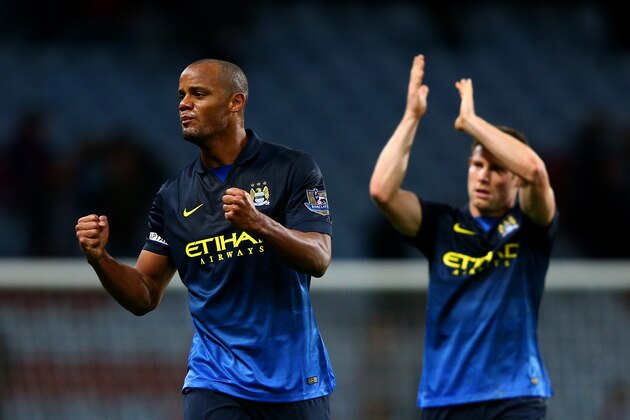 BIRMINGHAM, ENGLAND - OCTOBER 04:  Vincent Kompany and James Milner of Manchester City celebrate victory after the Barclays Premier League match between Aston Villa and Manchester City at Villa Park on October 4, 2014 in Birmingham, England.  (Photo by Ian Walton/Getty Images)
