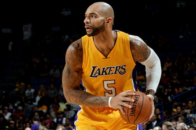 ONTARIO, CA - OCTOBER 12:  Carlos Boozer #5 of the Los Angeles Lakers handles the ball during the game against the Golden State Warriors on October 12, 2014 at Citizens Business Bank Arena in Ontario, California. NOTE TO USER: User expressly acknowledges and agrees that, by downloading and/or using this Photograph, user is consenting to the terms and conditions of the Getty Images License Agreement. Mandatory Copyright Notice: Copyright 2014 NBAE (Photo by Noah Graham/NBAE via Getty Images)