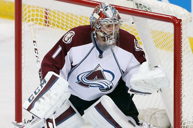 Colorado Avalanche goalie Semyon Varlamov of Russia defends against the Minnesota Wild in the first period of an NHL hockey game, Thursday, Oct. 9, 2014, in St. Paul, Minn. (AP Photo/Jim Mone)