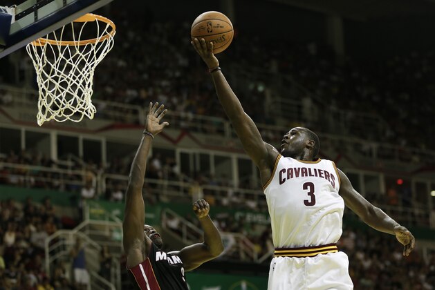 Cleveland Cavaliers' Dion Waiters shoots over Miami Heat's Luol Deng at a NBA preseason basketball game that's part of the NBA Global Games in Rio de Janeiro, Brazil, Saturday, Oct. 11, 2014. (AP Photo/Felipe Dana) Cleveland Cavaliers' Dion Waiters shoots over Miami Heat's Luol Deng at a NBA preseason basketball game that's part of the NBA Global Games in Rio de Janeiro, Brazil, Saturday, Oct. 11, 2014. (AP Photo/Felipe Dana)