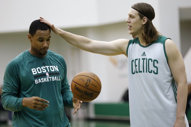 Boston Celtics' Kelly Olynyk, right, checks out Jared Sullinger's haircut during NBA basketball practice in Waltham, Mass., Tuesday, Sept. 30, 2014. (AP Photo/Michael Dwyer)