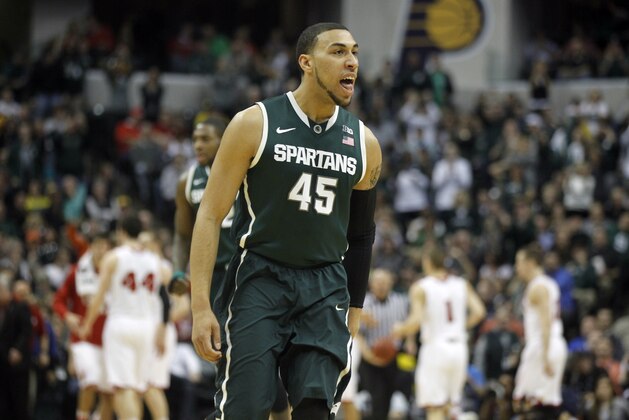 Michigan State guard Denzel Valentine reacts in the first half of an NCAA college basketball game against Wisconsin in the semifinals of the Big Ten Conference tournament Saturday, March 15, 2014, in Indianapolis. (AP Photo/Kiichiro Sato)