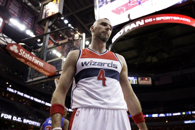 Washington Wizards center Marcin Gortat (4), from Poland, pauses after a play in the second half of a preseason NBA basketball game against the Detroit Pistons, Sunday, Oct. 12, 2014 in Washington. The Wizards won 91-89. (AP Photo/Alex Brandon)