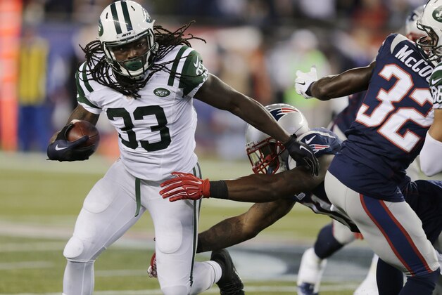 New York Jets running back Chris Ivory (33) carries against the New England Patriots during the first half of an NFL football game Thursday, Oct. 16, 2014, in Foxborough, Mass. (AP Photo/Charles Krupa)