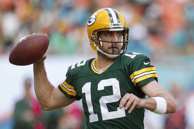 MIAMI GARDENS, FL - OCTOBER 12:  Quarterback Aaron Rodgers #12 of the Green Bay Packers throws in the second quarter during a game against the Miami Dolphins at Sun Life Stadium on October 12, 2014 in Miami Gardens, Florida.  (Photo by Joel Auerbach/Getty Images)