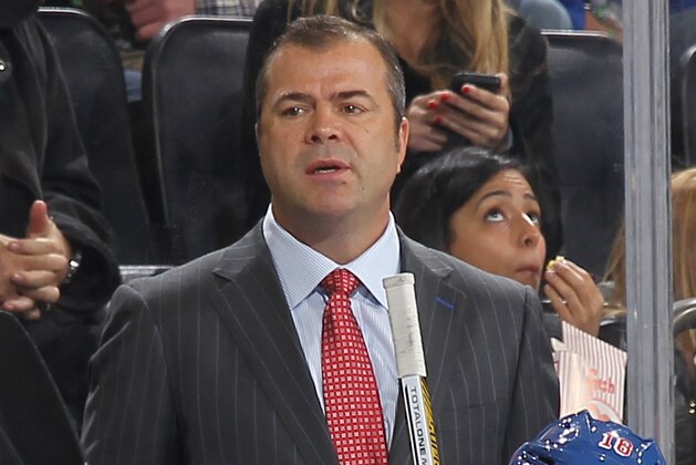 NEW YORK, NY - OCTOBER 12:  Head Coach Alain Vigneault of the New York Rangers looks on from the bench during a game against the Toronto Maple Leafs at Madison Square Garden on October 12, 2014 in New York City. The Toronto Maple Leafs won 6-3. (Photo by Jared Silber/NHLI via Getty Images)