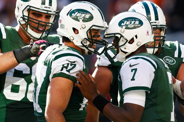 EAST RUTHERFORD, NJ - OCTOBER 12: Eric Decker #87 celebrates a touchdown with Geno Smith #7 of the New York Jets in the fourth quarter during a game against the Denver Broncos at MetLife Stadium on October 12, 2014 in East Rutherford, New Jersey.  (Photo by Jeff Zelevansky/Getty Images)