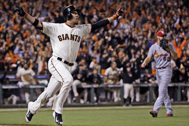 San Francisco Giants' Travis Ishikawa reacts after hitting a walk-off three-run home run during the ninth inning of Game 5 of the National League baseball championship series against the St. Louis Cardinals Thursday, Oct. 16, 2014, in San Francisco. The Giants won 6-3 to advance to the World Series. (AP Photo/David J. Phillip)