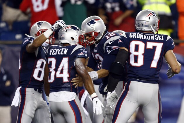 Oct 16, 2014; Foxborough, MA, USA;New England Patriots New England Patriots quarterback Tom Brady (12) celebrates with running back Shane Vereen (34) on his touchdown during the first half at Gillette Stadium. Mandatory Credit: Mark L. Baer-USA TODAY Sports