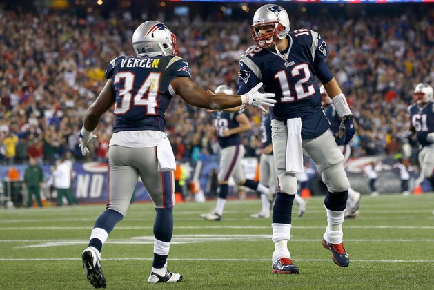 FOXBORO, MA - OCTOBER 16:  Shane Vereen #34 and Tom Brady #12 of the New England Patriots react after Vereen scored a touchdown during the second quarter against the New York Jets at Gillette Stadium on October 16, 2014 in Foxboro, Massachusetts.  (Photo by Jim Rogash/Getty Images)