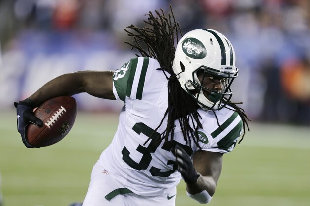 New York Jets running back Chris Ivory (33) scrambles for a gain in the first half of an NFL football game Thursday, Oct. 16, 2014, in Foxborough, Mass. (AP Photo/Charles Krupa)