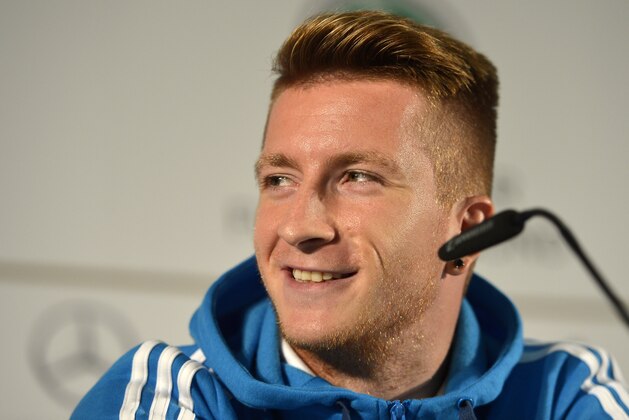 German player Marco Reus smiles during a press conference in Kamen, Germany, prior the UEFA EURO 2016 qualifying soccer match between Germany and Scotland, Friday, Sept. 5, 2014. (AP Photo/Martin Meissner)