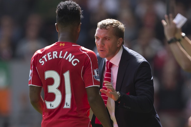 Liverpool's manager Brendan Rodgers, right, issues instructions to Raheem Sterling during their English Premier League soccer match against Southampton at Anfield Stadium, Liverpool, England, Sunday Aug. 17, 2014. (AP Photo/Jon Super)