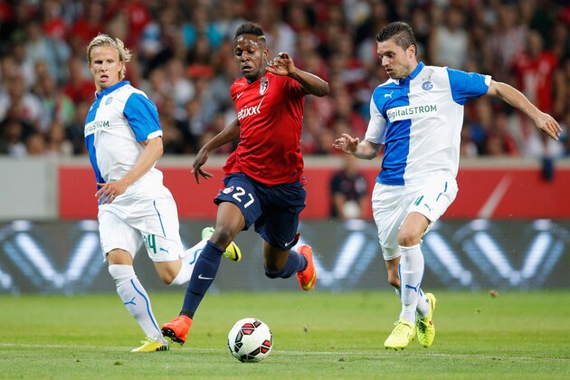 LILLE, FRANCE - AUGUST 05:  Divock Origi of Lille battles for the ball with Sanel Jahic and Moritz Bauer of Grasshopper during the UEFA Champions League third qualifying round 2nd leg match between LOSC Lille and Grasshopper Club Zurich at the Stade Pierre-Mauroy on August 5, 2014 in Lille, France.  (Photo by Dean Mouhtaropoulos/Getty Images)