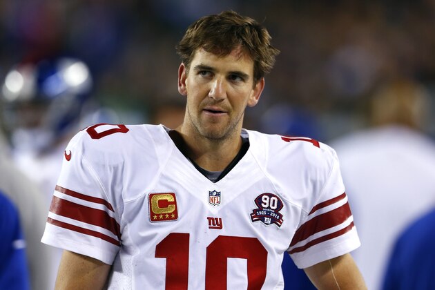 New York Giants quarterback Eli Manning stands on the sideline during the second half of an NFL football game against the Philadelphia Eagles, Sunday, Oct. 12, 2014, in Philadelphia. (AP Photo/Matt Rourke)