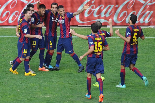 MADRID, SPAIN - OCTOBER 04:  Neymar (#11) of FC Barcelona celebrates with teammates after scoring his team's 2nd goal during the La Liga match between Rayo Vallecano de Madrid and FC Barcelona at Estadio Teresa Rivero on October 4, 2014 in Madrid, Spain.  (Photo by Denis Doyle/Getty Images)