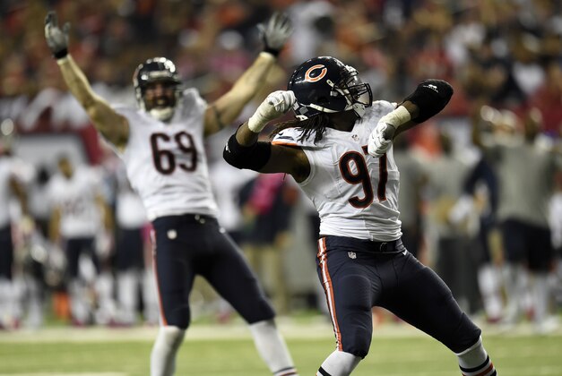 Oct 12, 2014; Atlanta, GA, USA; Chicago Bears defensive end Willie Young (97) and defensive end Jared Allen (69) react to a sack against the Atlanta Falcons during the second half at the Georgia Dome. The Bears defeated the Falcons 27-13. Mandatory Credit: Dale Zanine-USA TODAY Sports