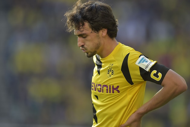 Dortmund's Mats Hummels reacts during the German Bundesliga soccer match between Borussia Dortmund and Hamburger SV in Dortmund, Germany, Saturday, Oct. 4, 2014. Dortmund was defeated by Hamburg with 0-1. (AP Photo/Martin Meissner)